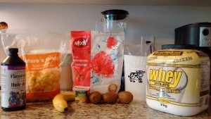 Shake ingredients: banana, kiwi, frozen raspberries, strawberries and mango, milk, whey protein, milk, yogurt.